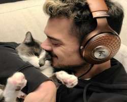 He has a cute cat whom he loves so much.